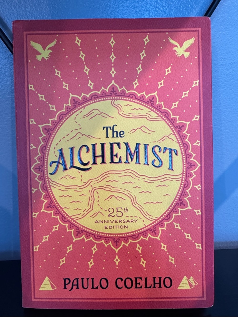 The Alchemist 25th Anniversary Edition by Paulo Coelho - Red & Gold Cover